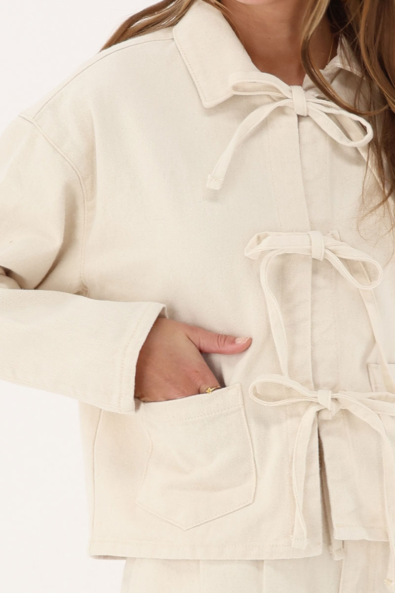 Beige denim jacket with bows | My Jewellery