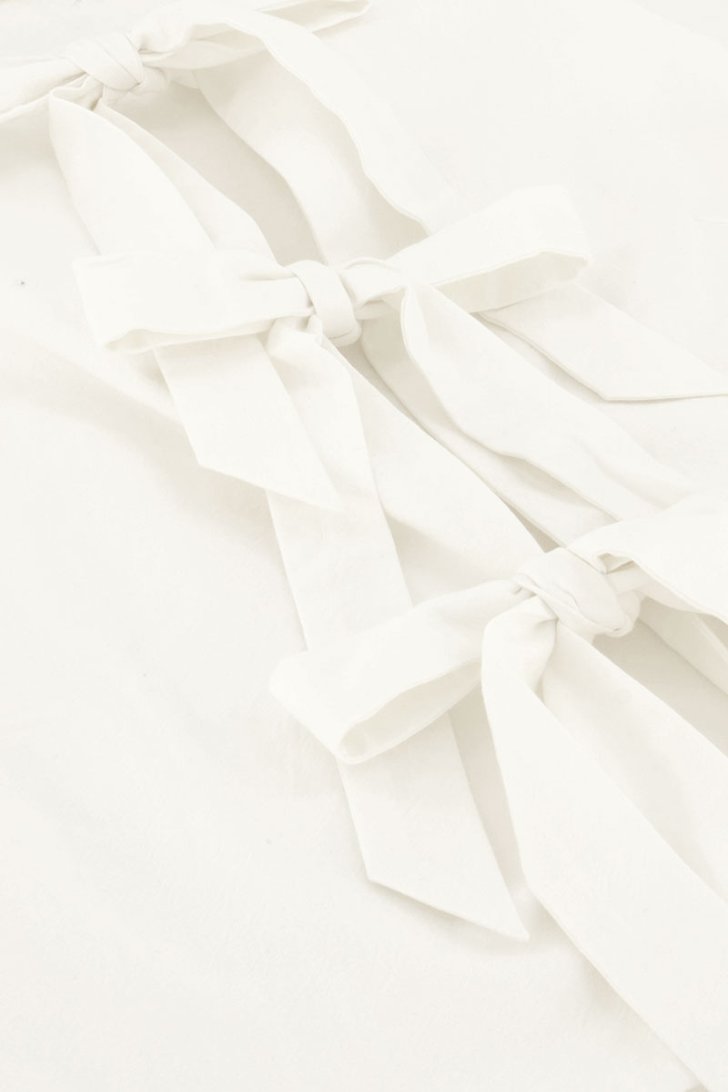 Beige gilet with bows | My Jewellery