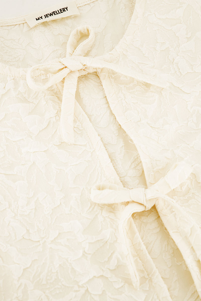 Beige jacquard vest with bows | My Jewellery