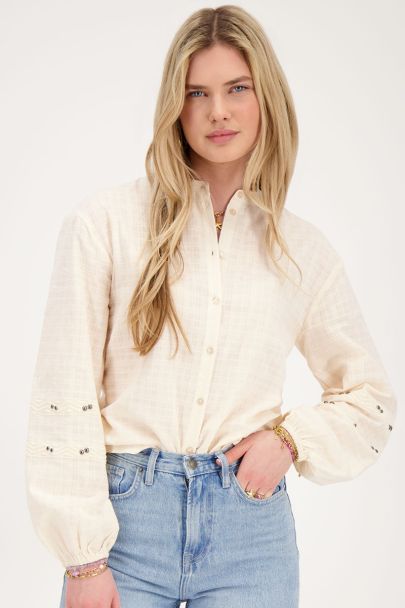 Beige blouse with tapes and studs