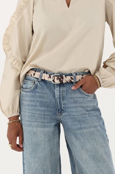 Beige riem met koeienprint