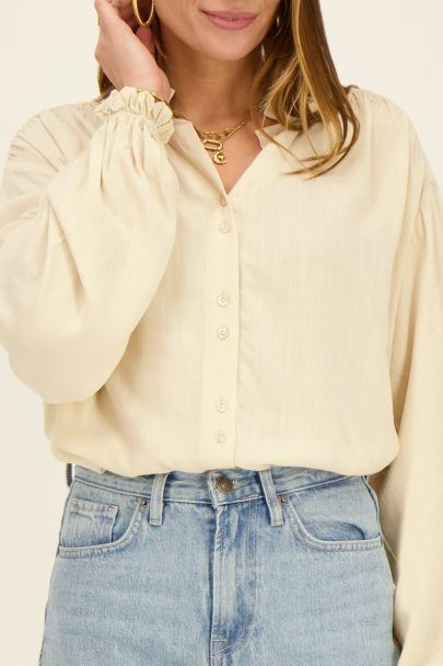 Beige blouse with smock details