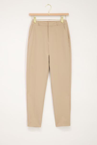 Beige trousers with press crease