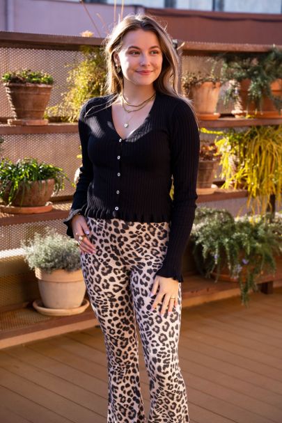 Beige leopard print flared trousers