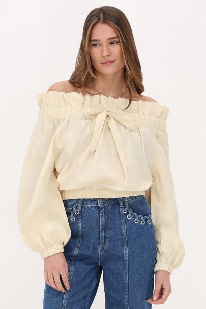 Beige off-shoulder top met ruffle en strik