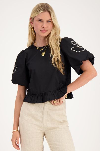 Black floral blouse with bows at the back 