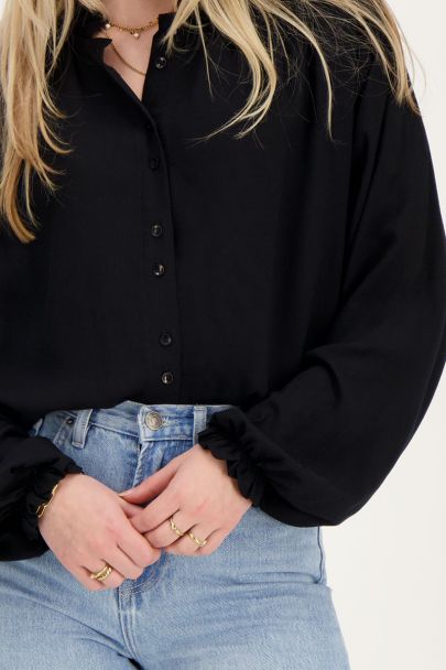 Schwarze Bluse mit Smoking-Details
