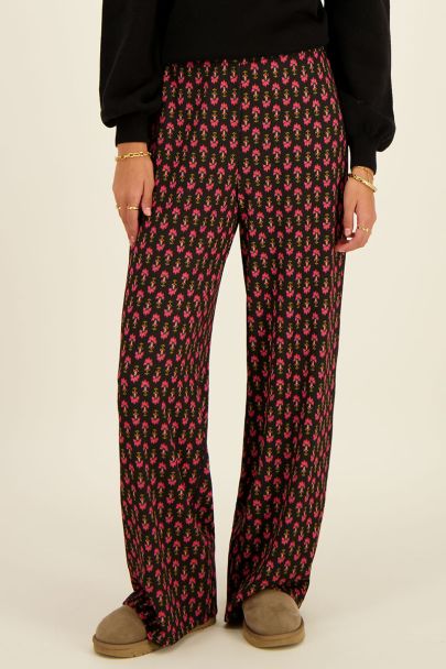 Black crinkle trousers with pink ornamental print