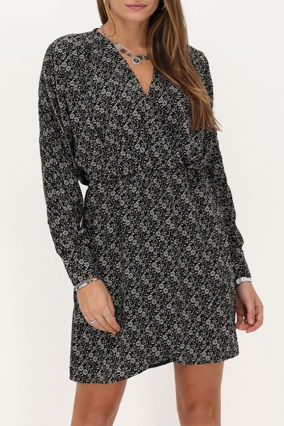 Black dress with beige flowers