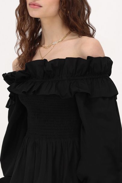 Zwarte jurk met ruffles & smock