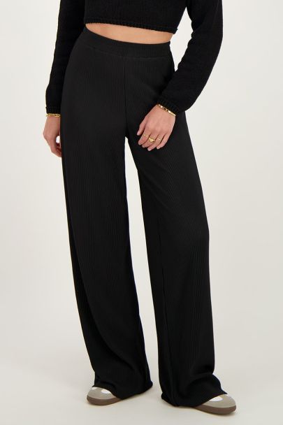 Black pleated trousers with elasticated waistband