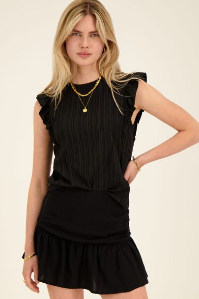 Black ruffled top with structure