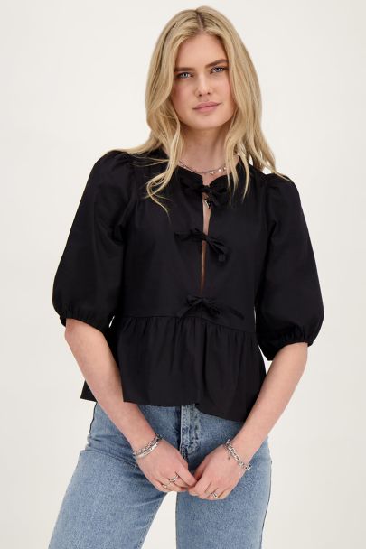 Black top with bows and puffed sleeves