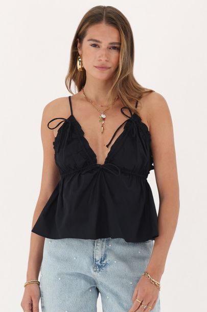 Zwarte top met spaghetti bandjes en strikjes