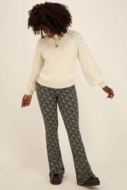 Legging flare noir avec fleurs beiges