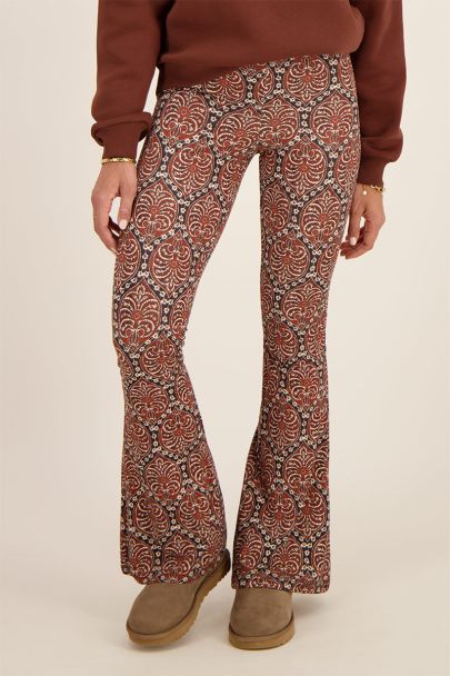 Brown mediterranean print flared trousers