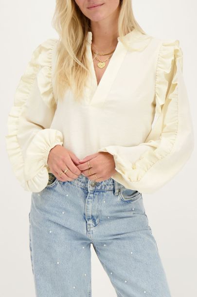 Cream blouse with ruffled sleeves
