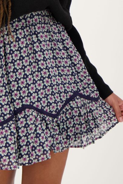 Donkerblauw rokje met bloemenprint en ruffles