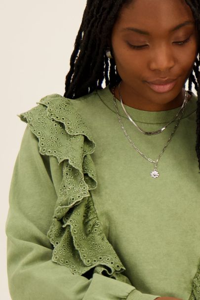 Dark green sweater with lace details