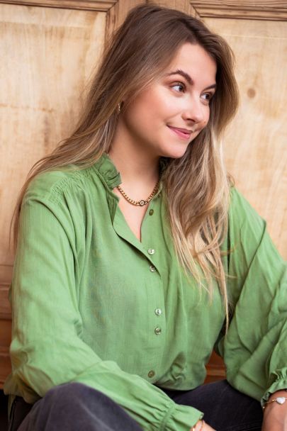 Donkergroene blouse met wijdvallende mouwen
