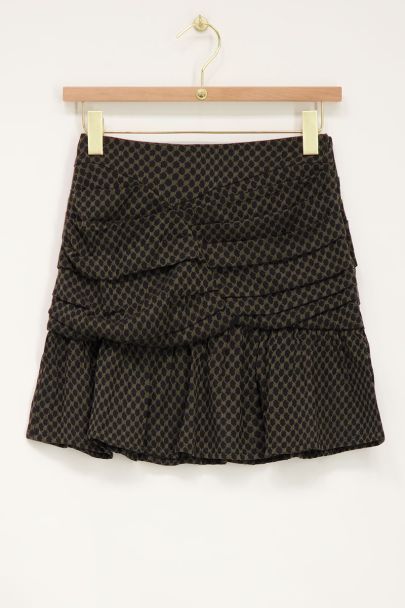 Green ruffled skirt with black graphic jacquard
