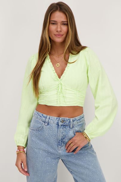 Groene crop top met ruffles en smock