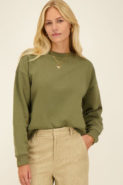 Groene sweater c'est la vie