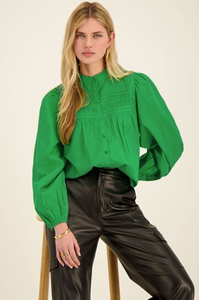Green pleated blouse with puff sleeves