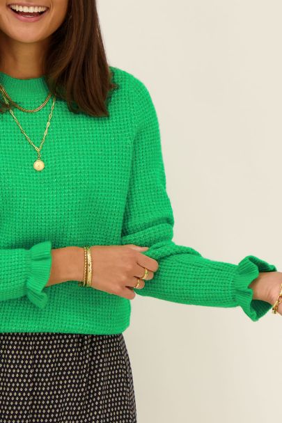 Green sweater with ruffle detail