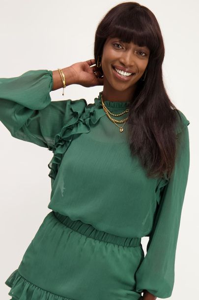 Groene doorschijnende blouse met ruffles