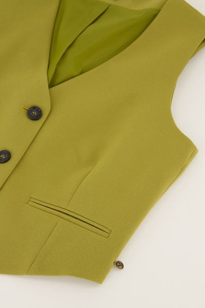Green gilet with buttons