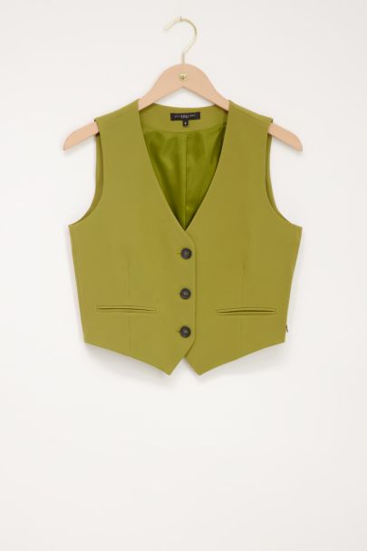 Groene gilet met knopen