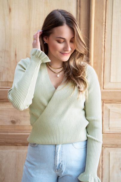 Grüner Pullover mit Wickel-Design und Rüschen