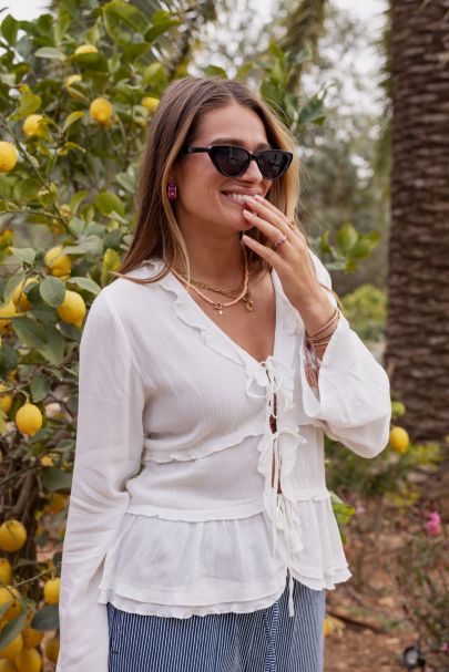 White top with cord & flared sleeves