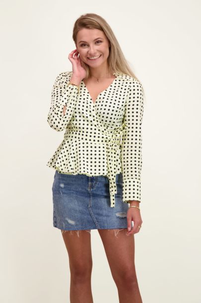 Light yellow wrap blouse with polka dots