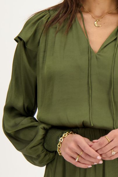 Green satin-look blouse with ruffles