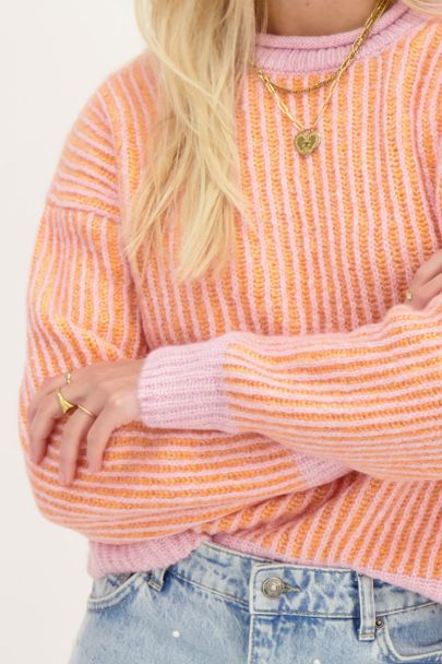 Orange knit sweater with pink stripes