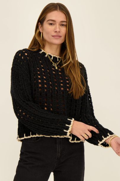 Black cable knit sweater with contrasting seam