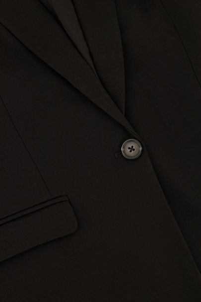 Zwart lang gilet met klepzakken