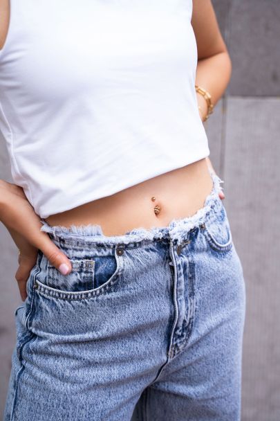 Clover charm navel piercing