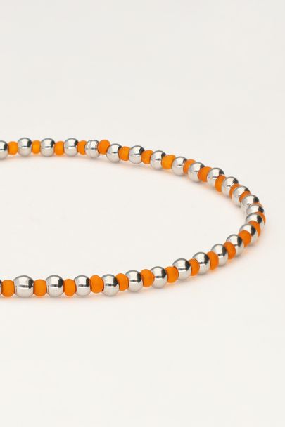 Ocean elastieken armband en kraaltjes oranje