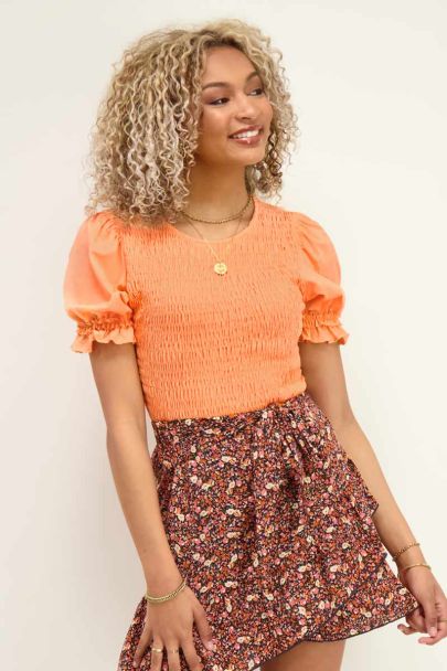 Orange smock top with puff sleeves