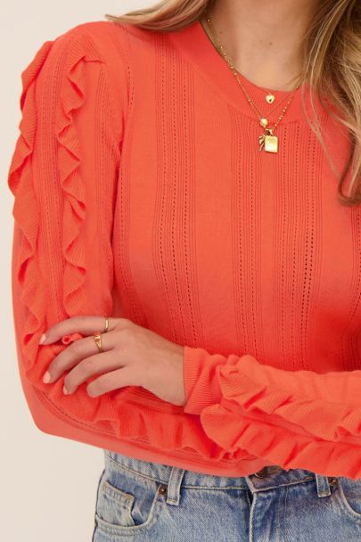 Pull orange en maille ajouré avec volants