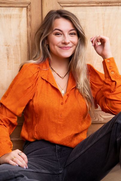 Oranje blouse met patroon