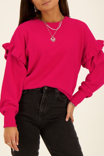 Rosa Pullover mit Rüschen