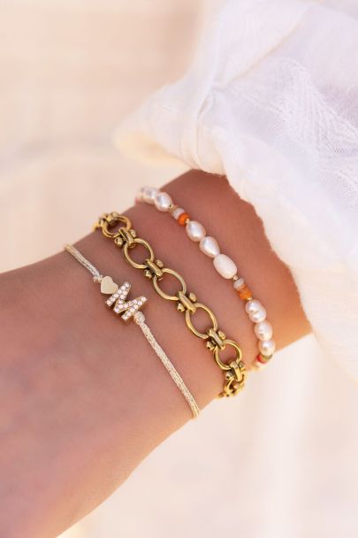 Beige initial bracelet