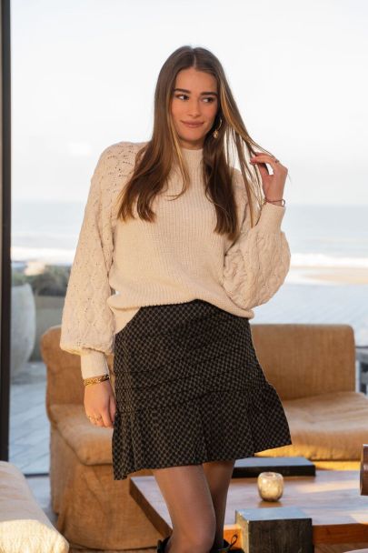 Beige sweater with knitted sleeves