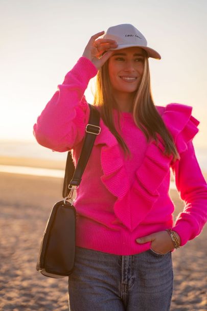 Pink sweater with layered ruffles