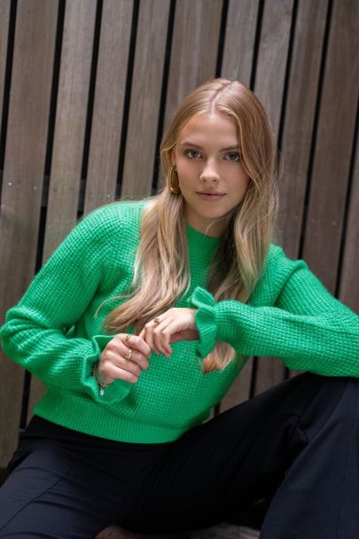 Groene trui met ruffle uiteinde