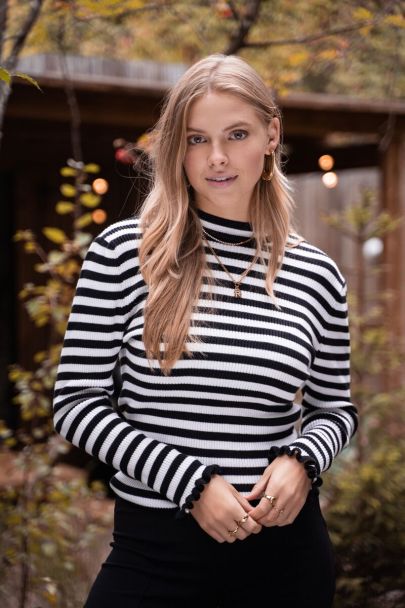 Black-white striped top featuring ruffle